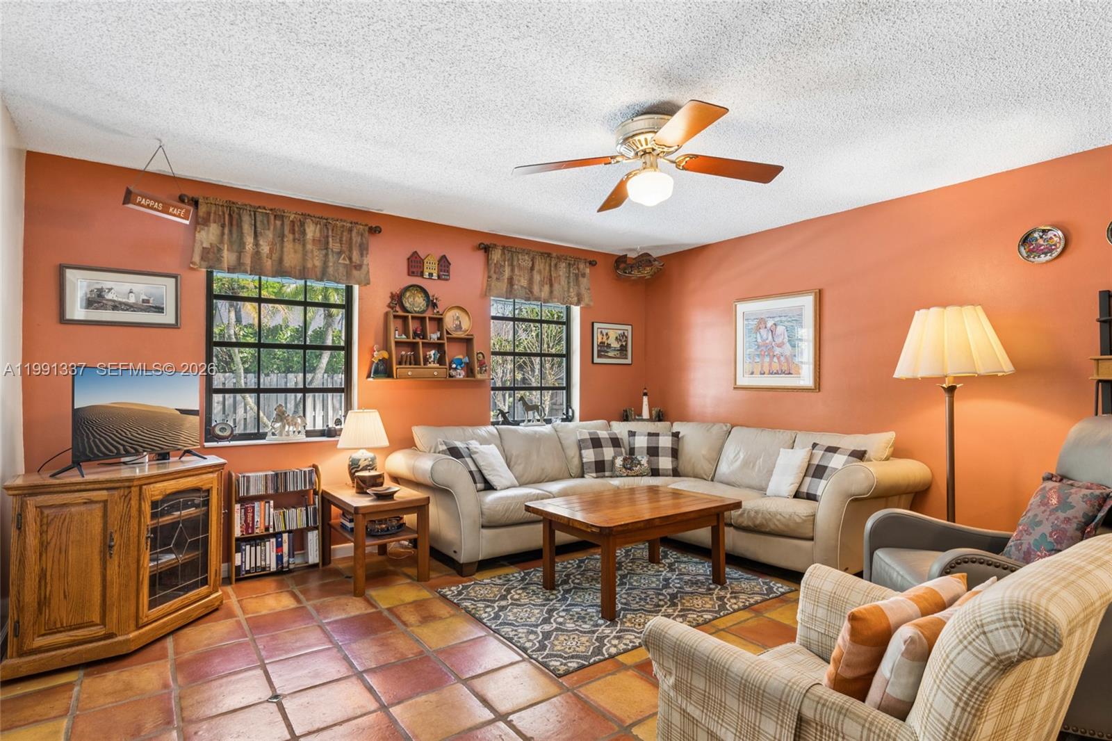 11403 Southwest 129th Place Miami, FL 33186 - Photo 13 of 38 a living room with furniture and a window