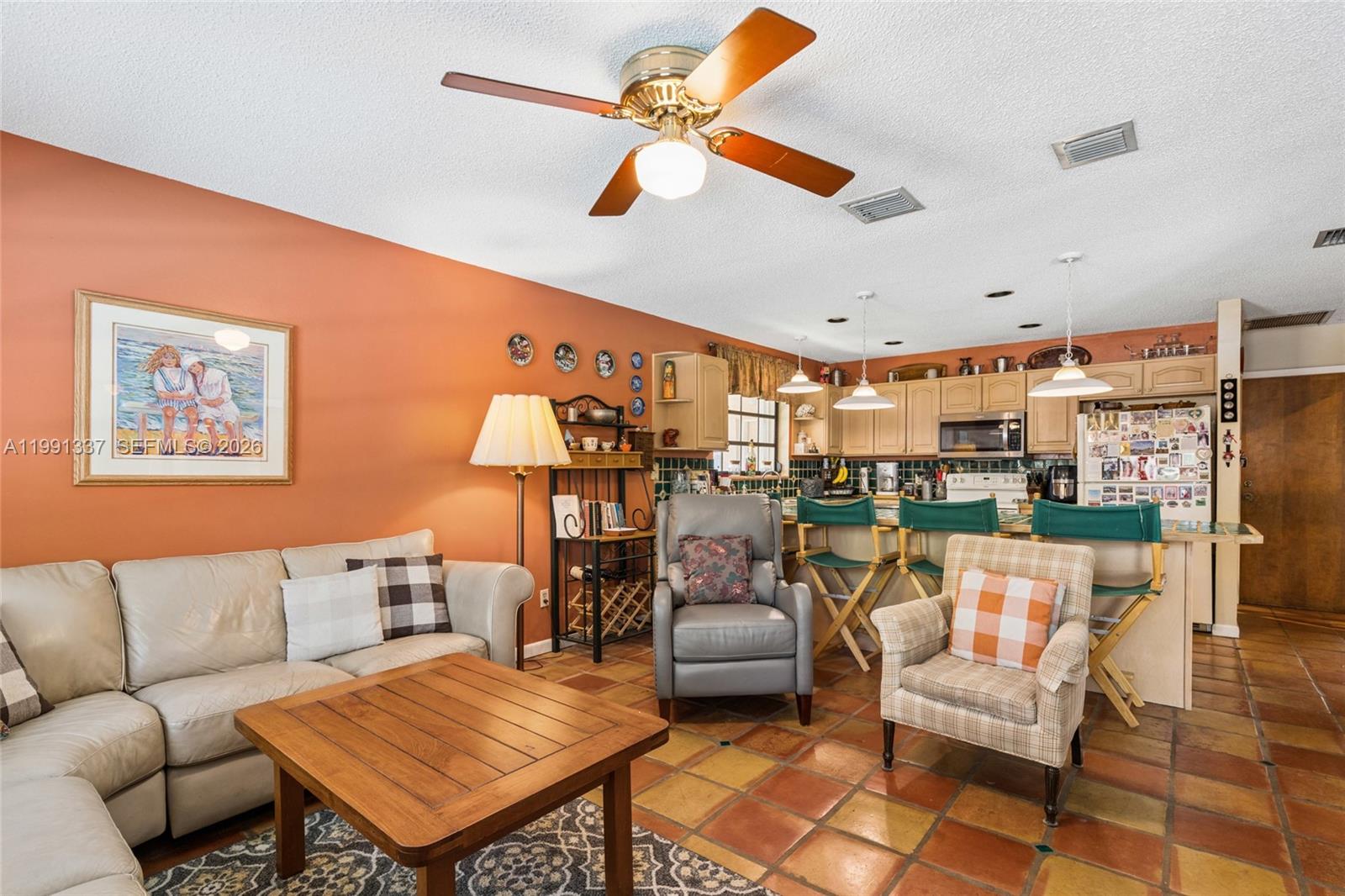 11403 Southwest 129th Place Miami, FL 33186 - Photo 14 of 38 a living room with furniture kitchen view and a large window