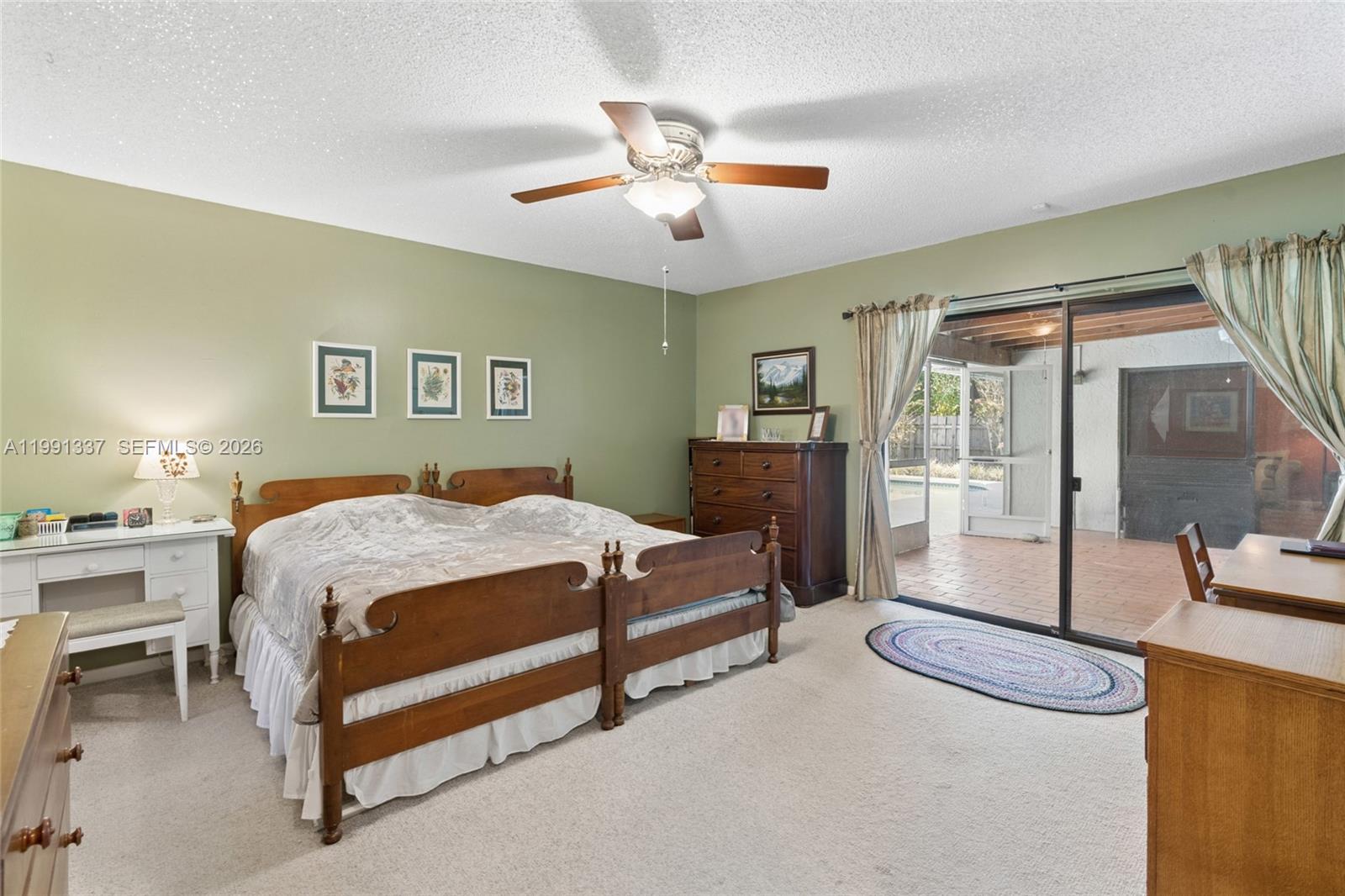 11403 Southwest 129th Place Miami, FL 33186 - Photo 17 of 38 a bedroom with a bed and window