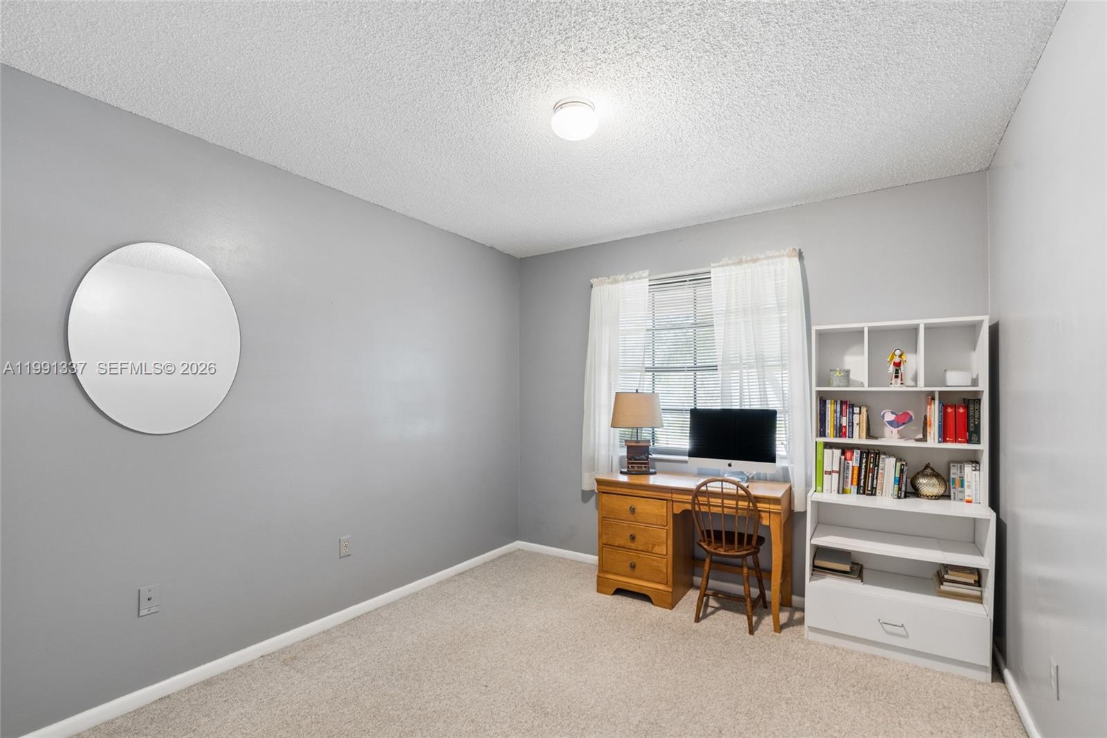 11403 Southwest 129th Place Miami, FL 33186 - Photo 22 of 38 a view of a room with shelves