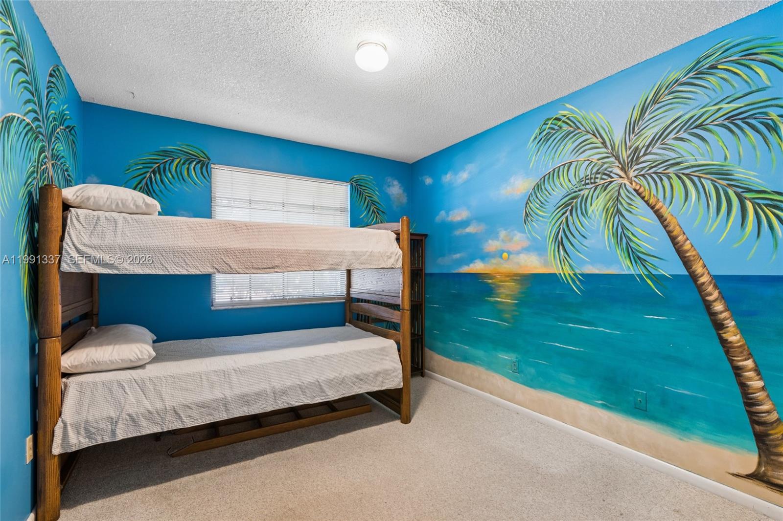 11403 Southwest 129th Place Miami, FL 33186 - Photo 23 of 38 a bedroom with a bed and a balcony view