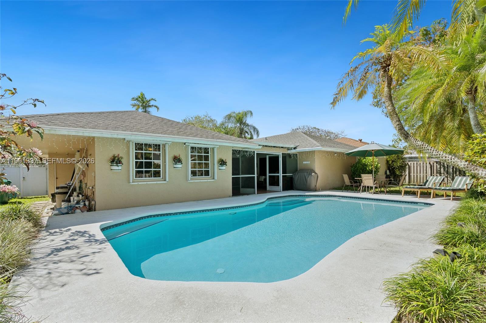 11403 Southwest 129th Place Miami, FL 33186 - Photo 30 of 38 a view of a house with a swimming pool