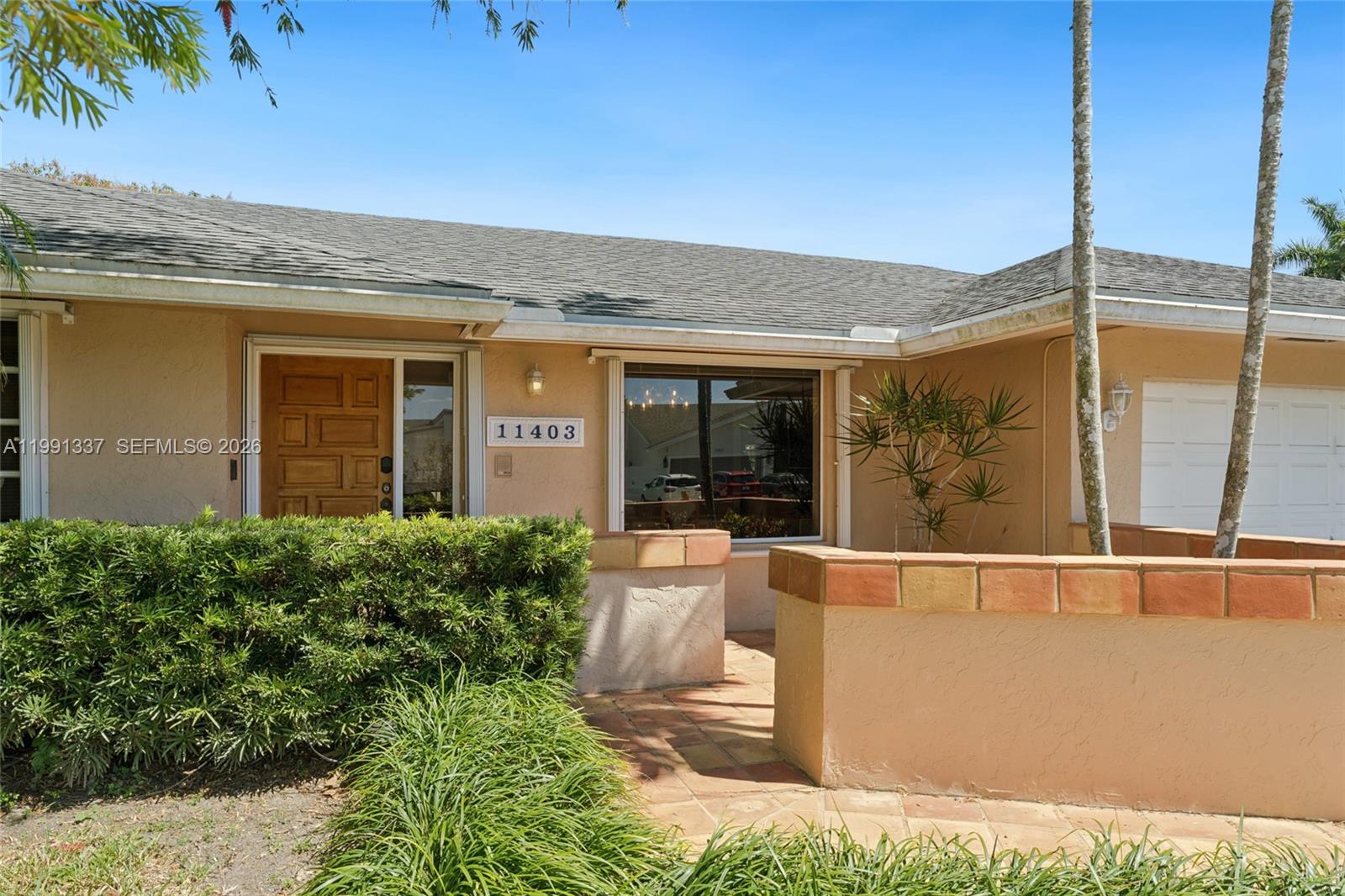 11403 Southwest 129th Place Miami, FL 33186 - Photo 3 of 38 a view of a house with a outdoor space
