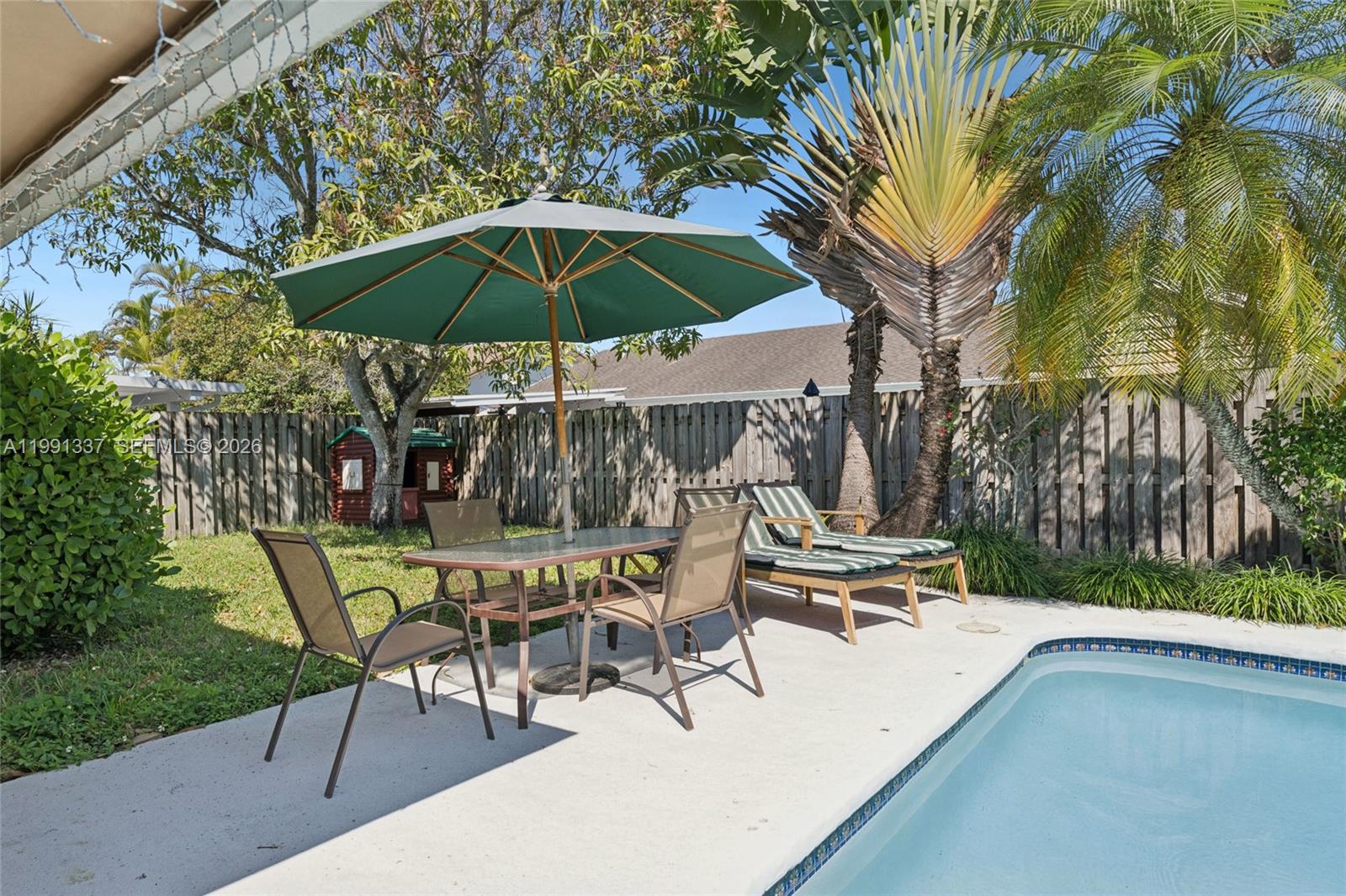 11403 Southwest 129th Place Miami, FL 33186 - Photo 32 of 38 a view of outdoor space yard and patio