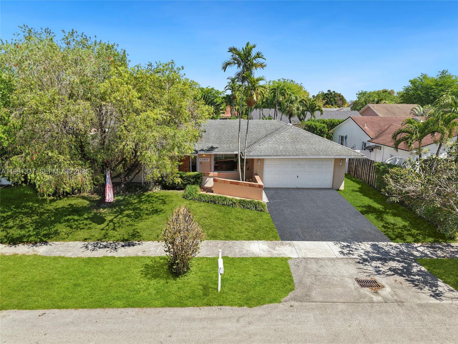 11403 Southwest 129th Place Miami, FL 33186 - Photo 33 of 38 front view of a house with a yard