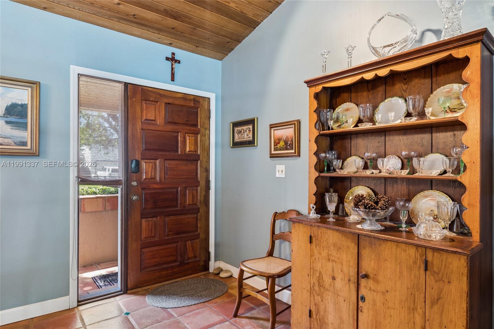 11403 Southwest 129th Place Miami, FL 33186 - Photo 6 of 38 a room with lots of different colored cloths