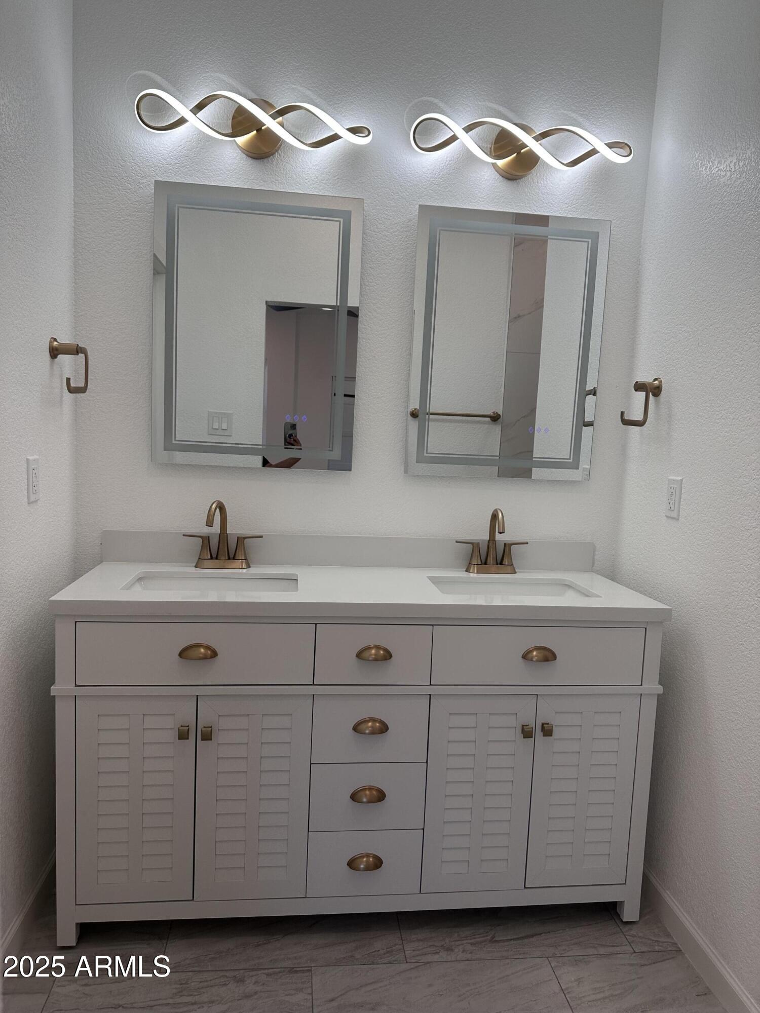 722 East 3rd Street Douglas, AZ 85607 - Photo 15 of 24 a bathroom with a sink vanity and a mirror