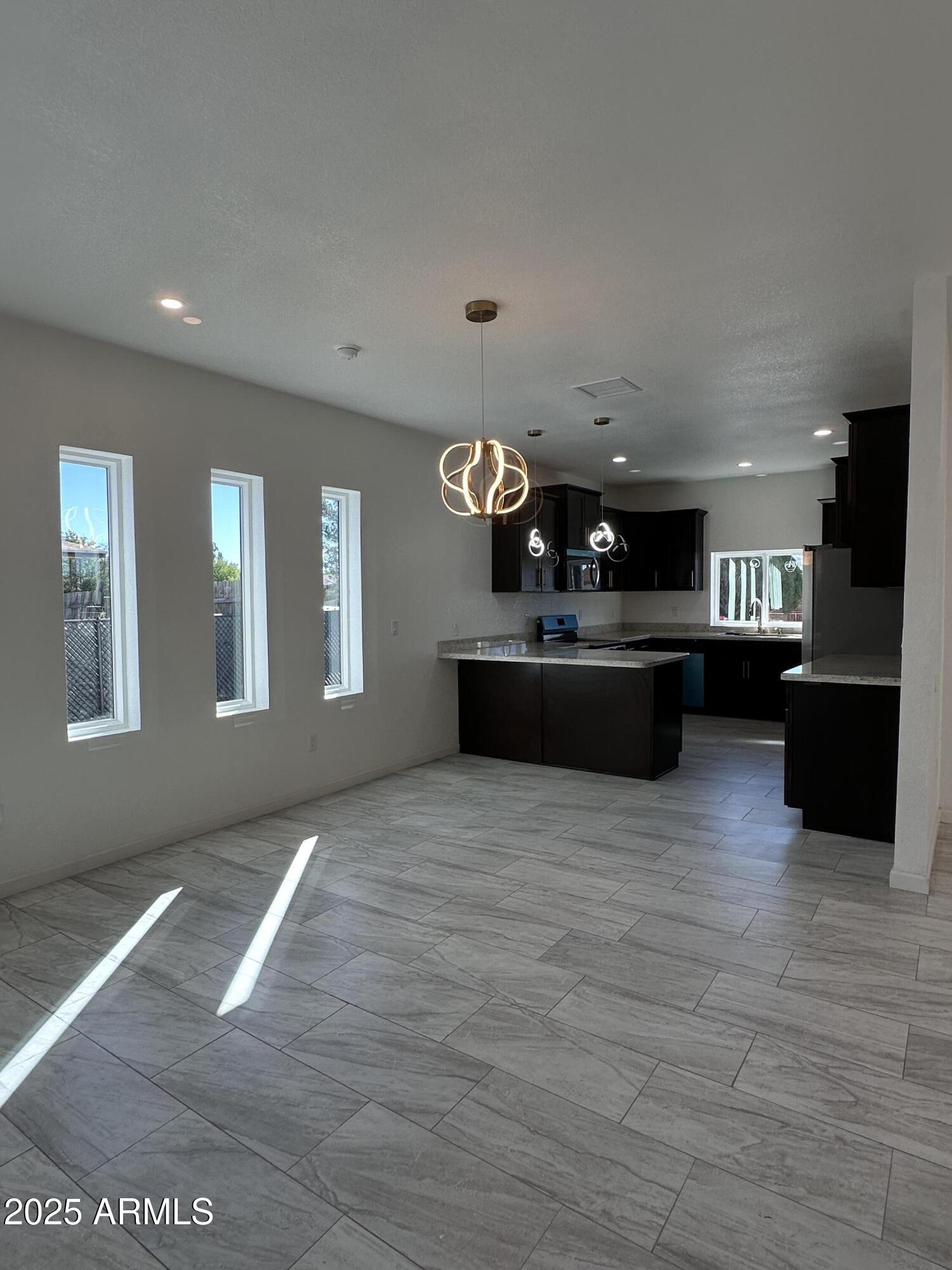 722 East 3rd Street Douglas, AZ 85607 - Photo 7 of 24 a lobby with furniture and windows