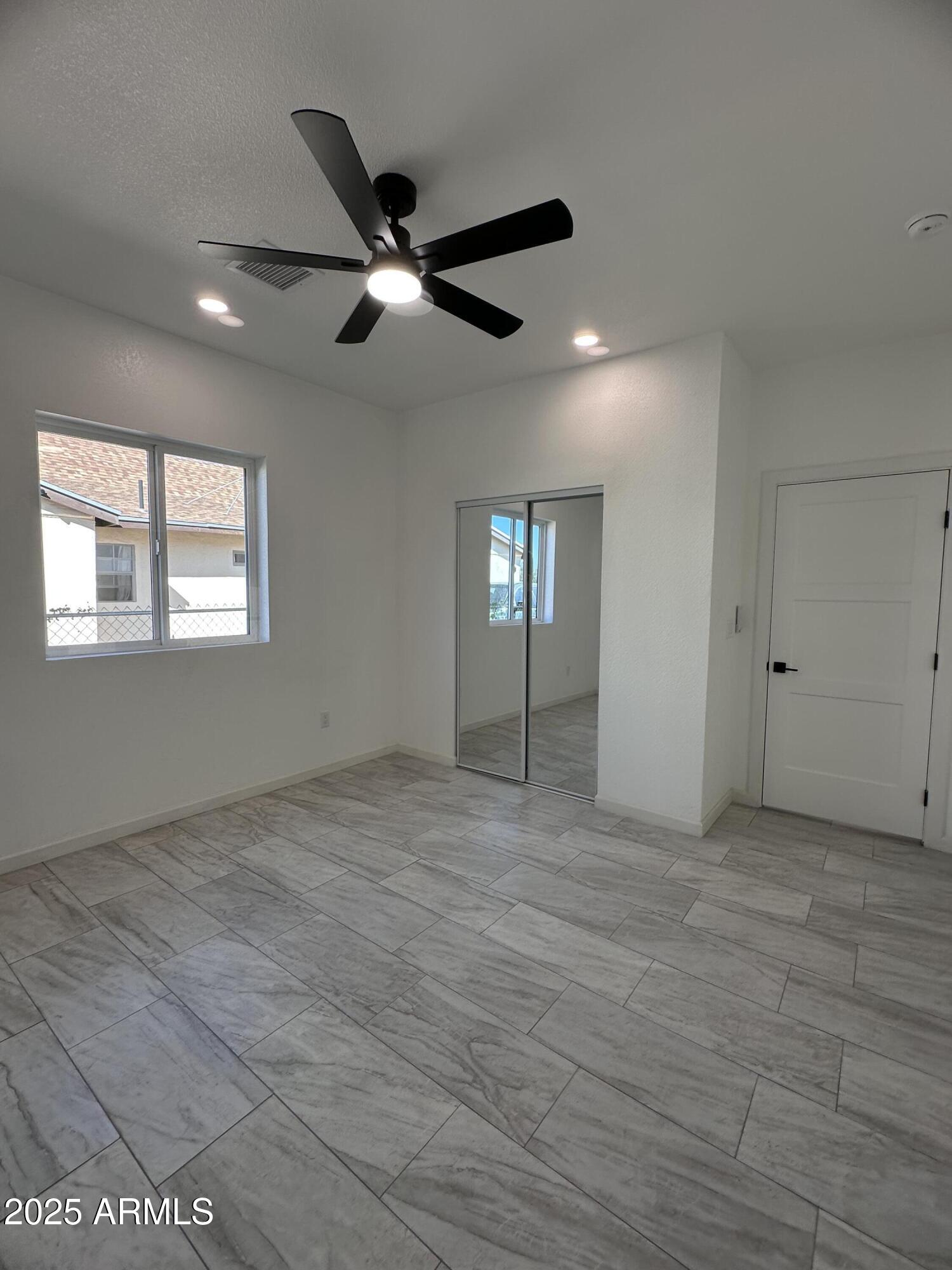 722 East 3rd Street Douglas, AZ 85607 - Photo 8 of 24 a view of an empty room with a window