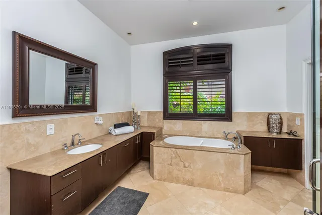 a bathroom with a bathtub and a sink