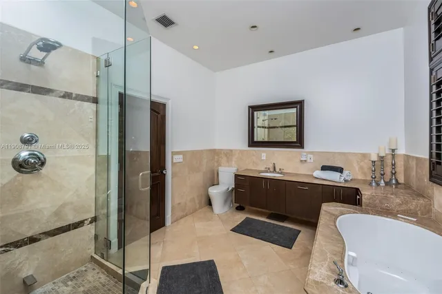 a view of bathroom with dual sinks