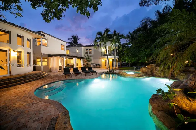 a view of a swimming pool with a patio