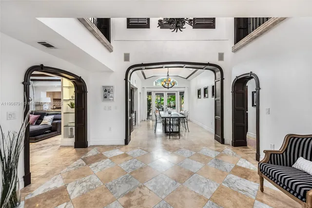 a view of entryway and bedroom with furniture