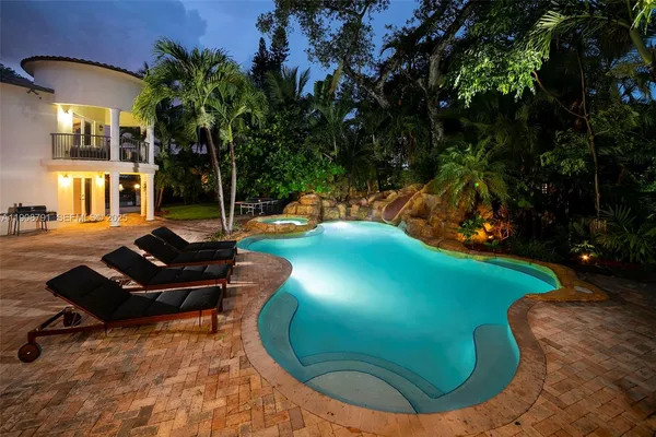 a view of a chairs in a backyard