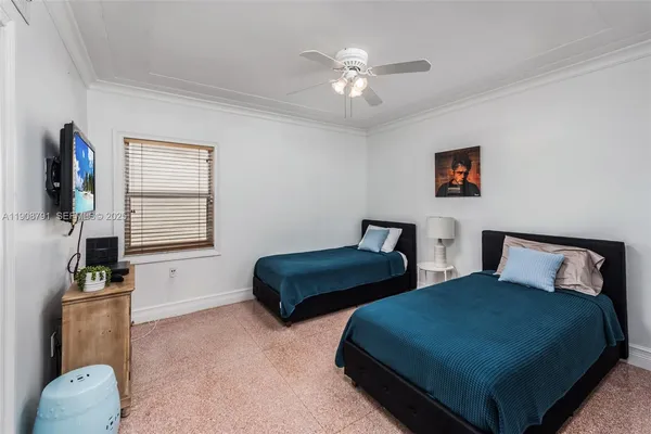 a bedroom with furniture and a window