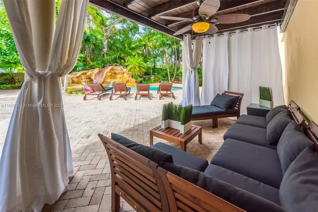 a outdoor living space with furniture and garden view