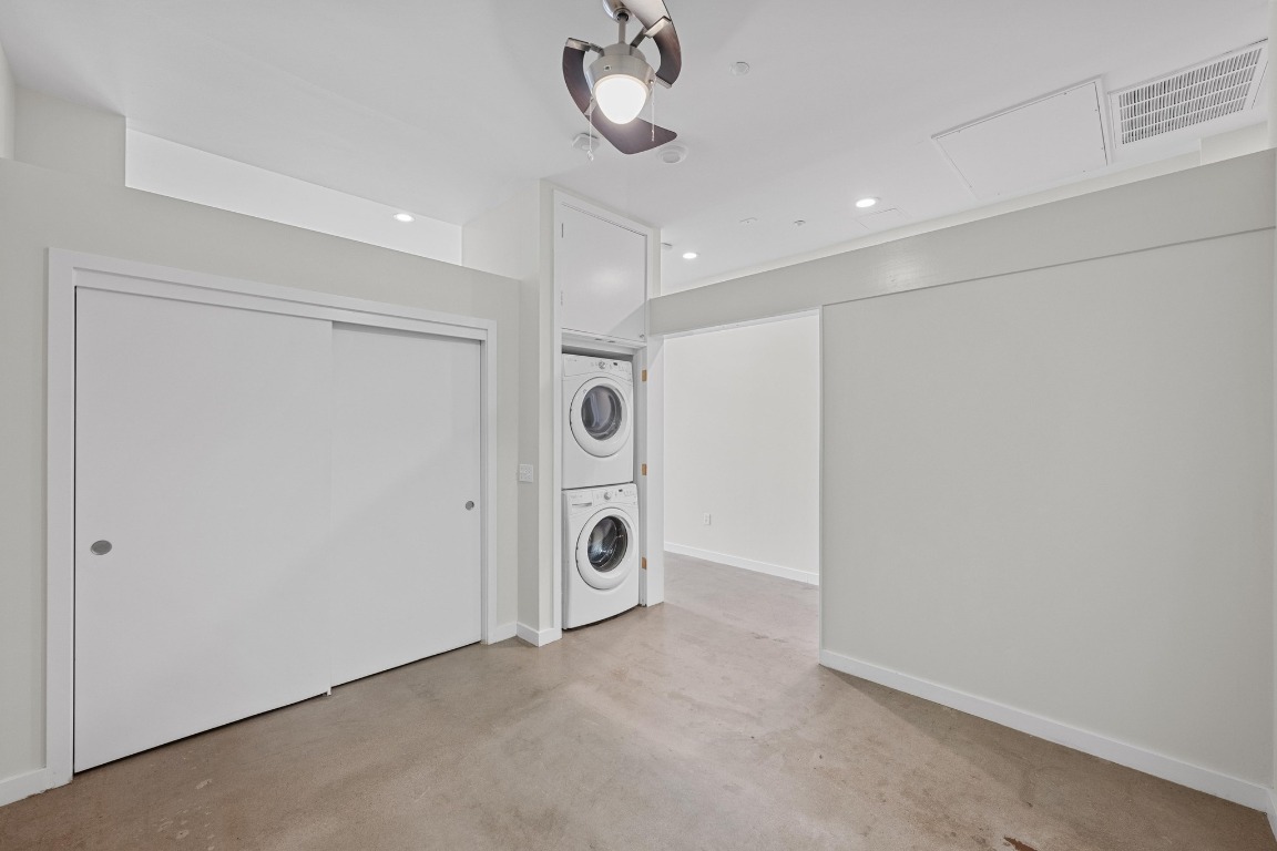 507 Sabine Street, Unit 503 Austin, TX 78701 - Photo 16 of 22 a view of an empty room and chandelier fan