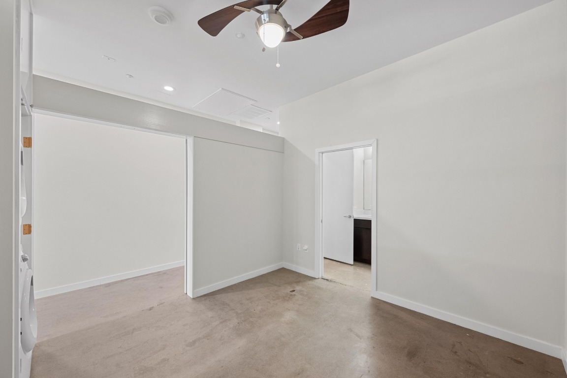 507 Sabine Street, Unit 503 Austin, TX 78701 - Photo 18 of 23 wooden floor in an empty room with a ceiling fan