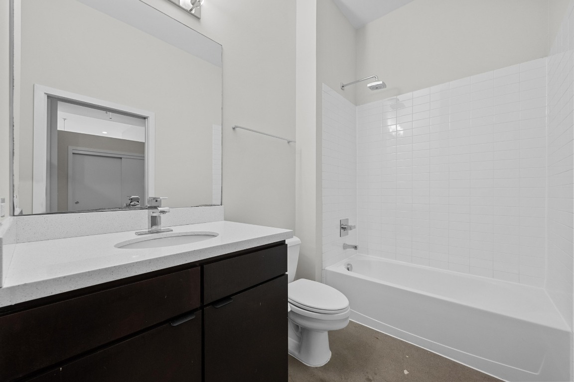507 Sabine Street, Unit 503 Austin, TX 78701 - Photo 20 of 23 a bathroom with a sink a toilet and shower