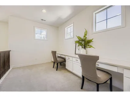 a workspace with furniture and window