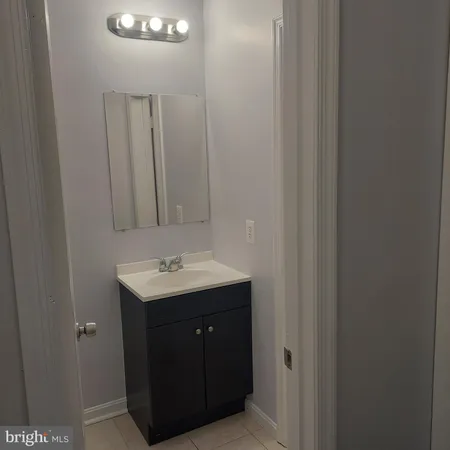 a bathroom with a sink and mirror