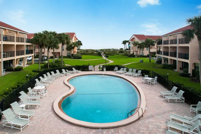 a view of a swimming pool with a garden