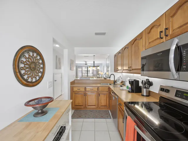 a kitchen with stainless steel appliances granite countertop a stove and a refrigerator