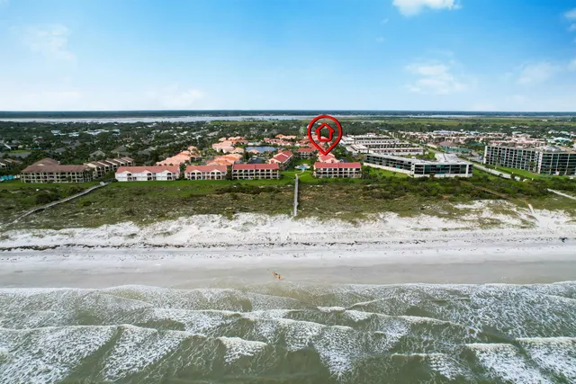 a living room with furniture and a large window with garden view