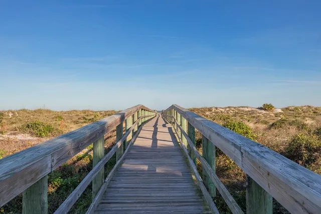 a view of a swimming pool with an outdoor seating