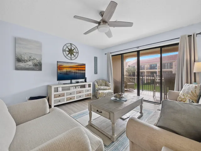 a living room with furniture and a table