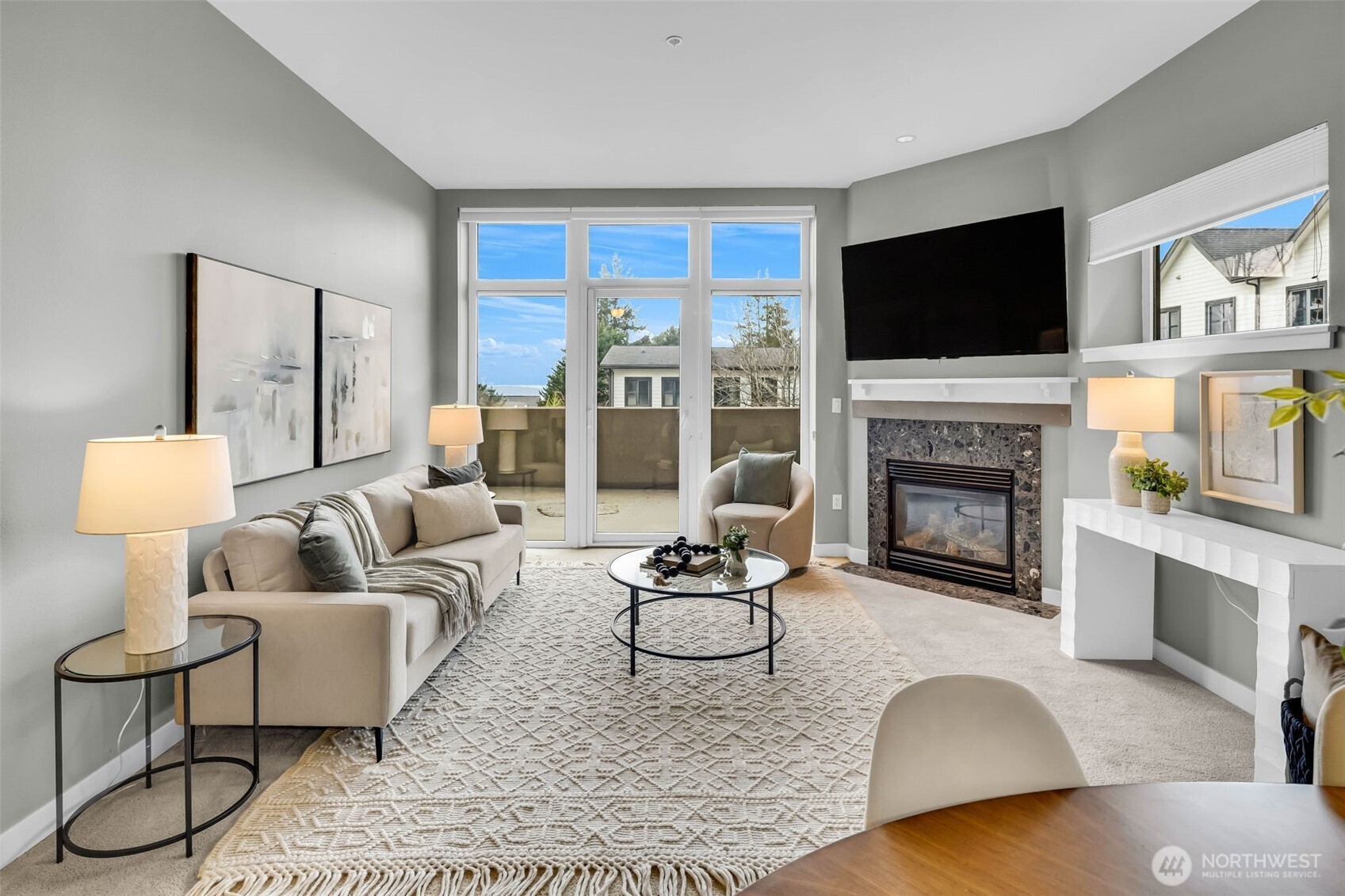 5001 California Avenue Southwest, Unit 103 Seattle, WA 98136 - Photo 11 of 40 a living room with furniture fireplace and a flat screen tv