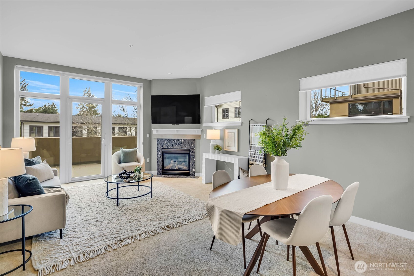 5001 California Avenue Southwest, Unit 103 Seattle, WA 98136 - Photo 13 of 40 a view of a livingroom with furniture and a fireplace