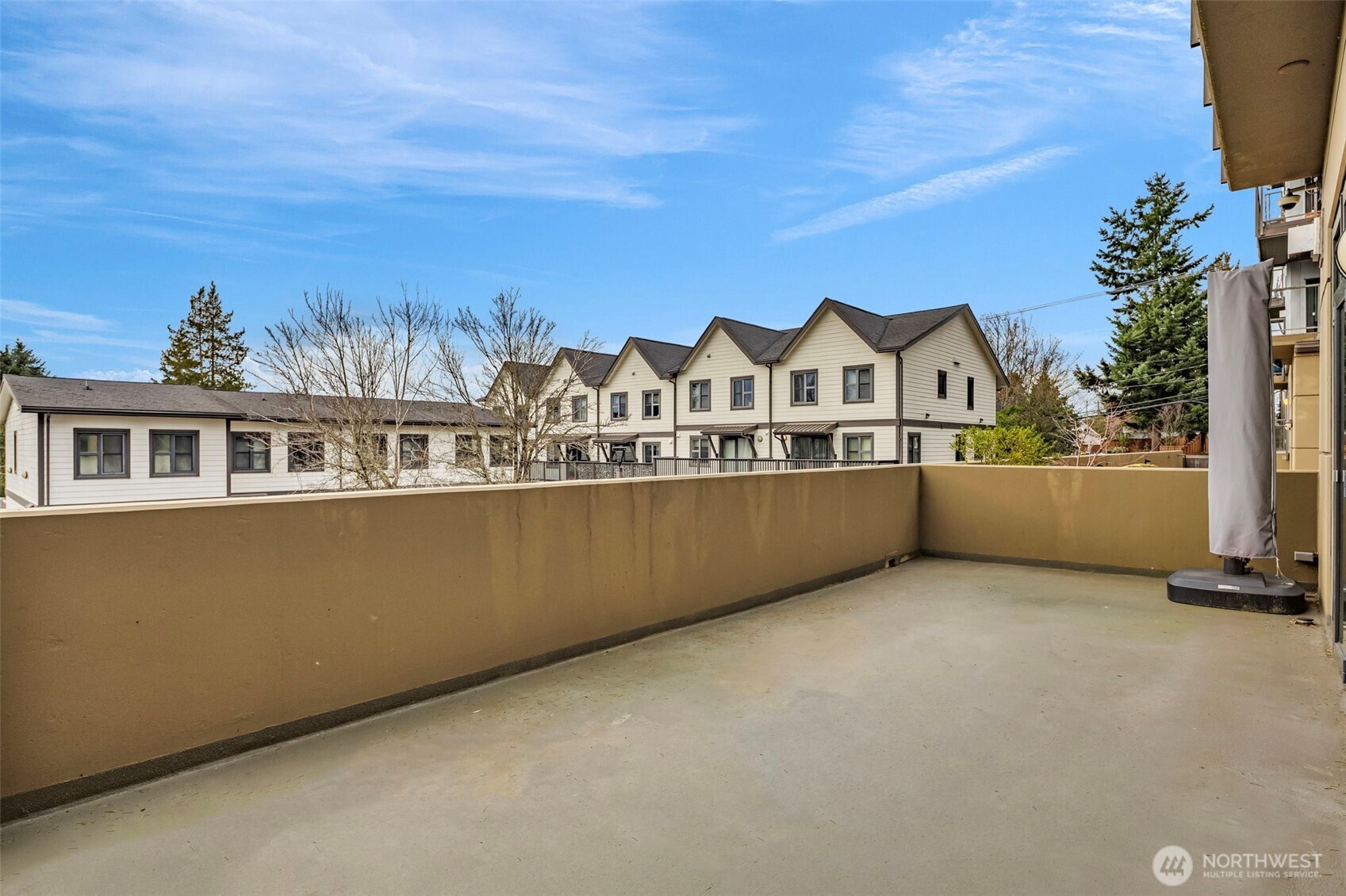 5001 California Avenue Southwest, Unit 103 Seattle, WA 98136 - Photo 15 of 40 a view of a house with a balcony