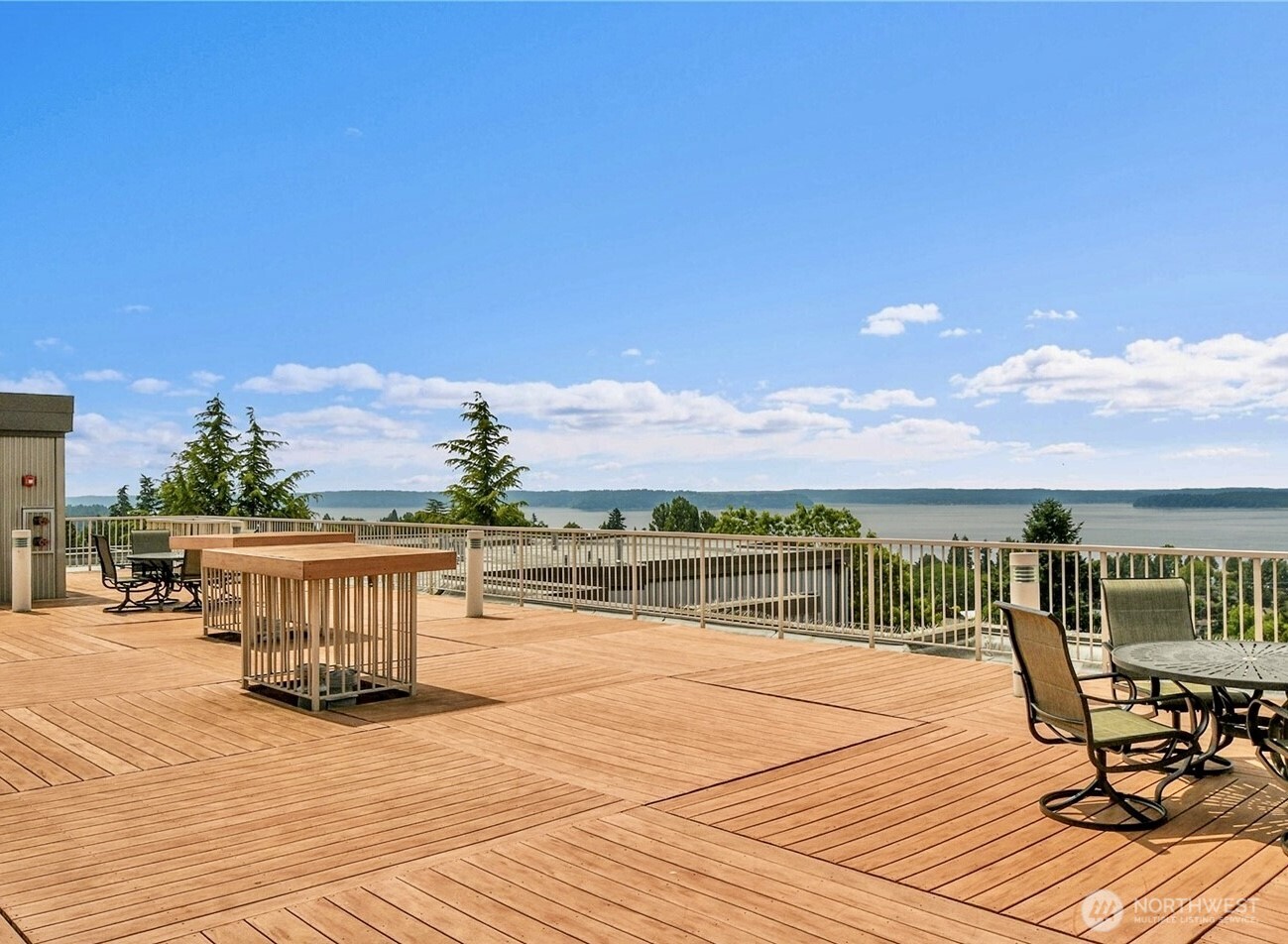 5001 California Avenue Southwest, Unit 103 Seattle, WA 98136 - Photo 2 of 40 a view of a terrace with wooden floor and city view