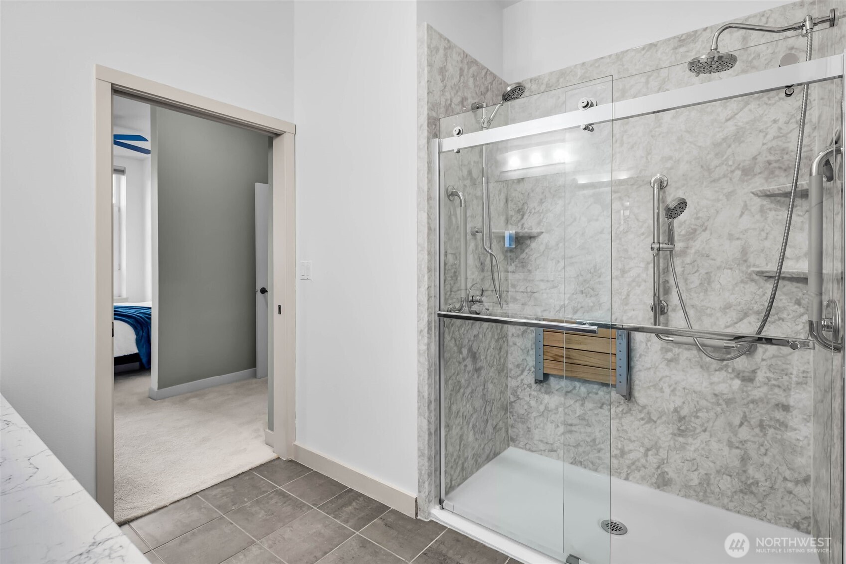 5001 California Avenue Southwest, Unit 103 Seattle, WA 98136 - Photo 22 of 40 a bathroom with a bathtub and a shower