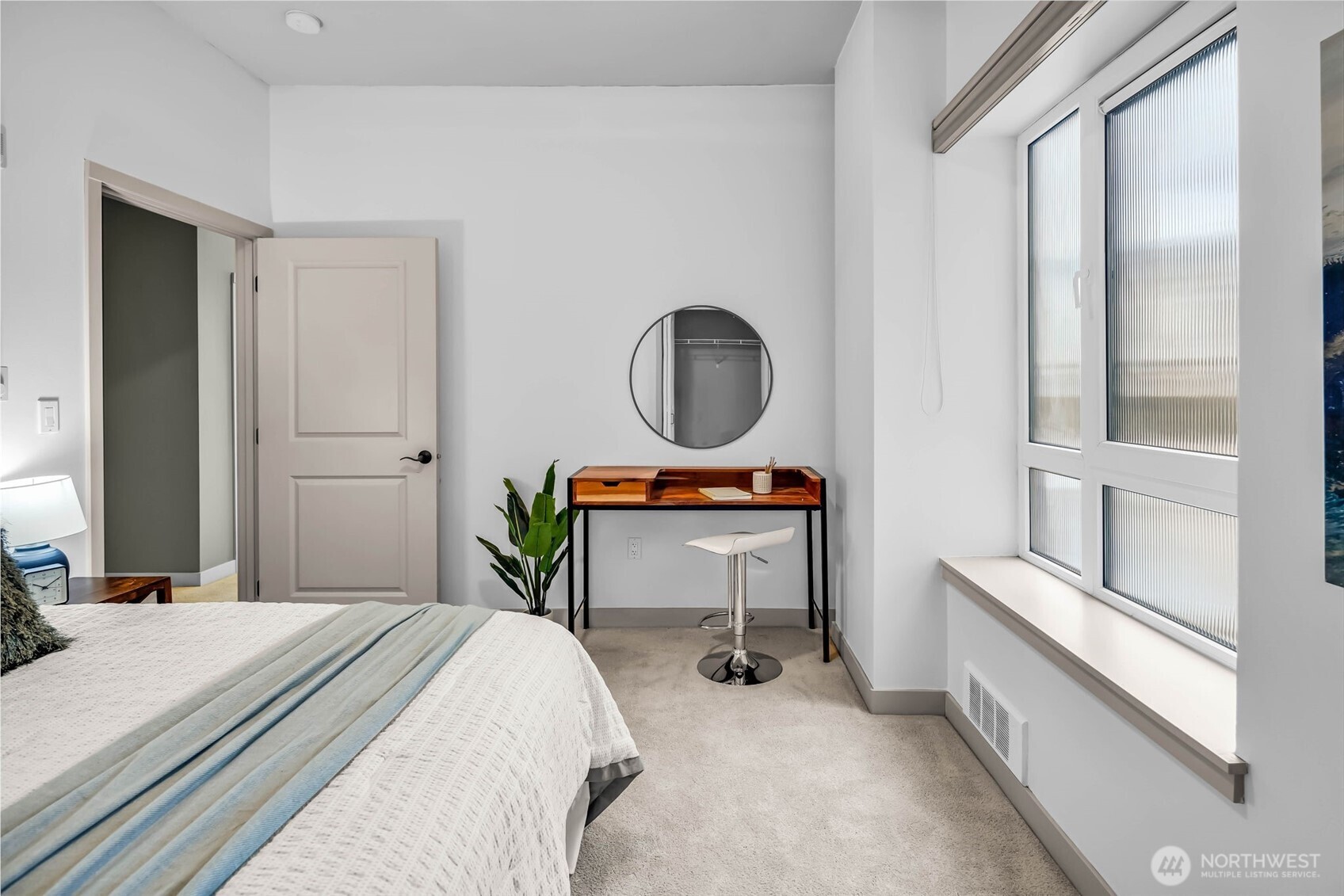 5001 California Avenue Southwest, Unit 103 Seattle, WA 98136 - Photo 26 of 40 a bedroom with a bed and a table