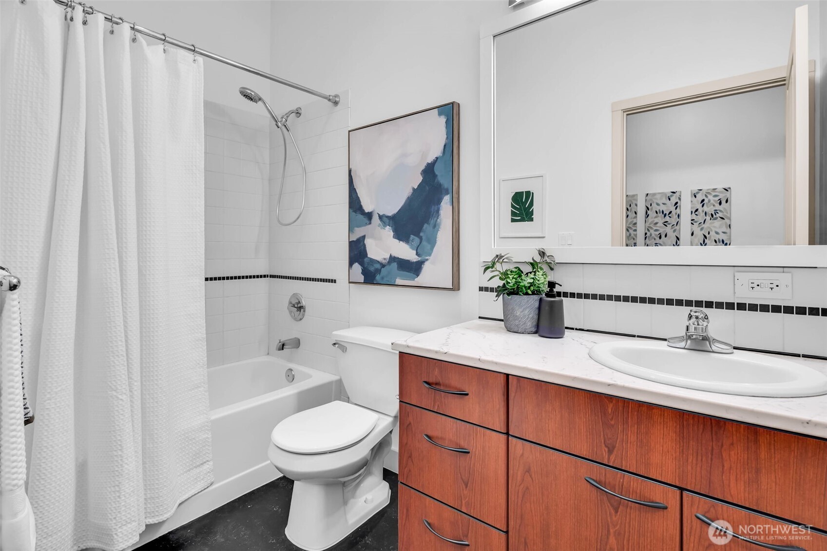5001 California Avenue Southwest, Unit 103 Seattle, WA 98136 - Photo 27 of 40 a bathroom with a sink a toilet and a mirror