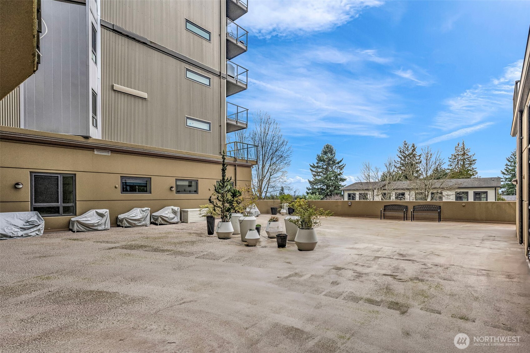 5001 California Avenue Southwest, Unit 103 Seattle, WA 98136 - Photo 39 of 40 a view of a cars park in front of a building