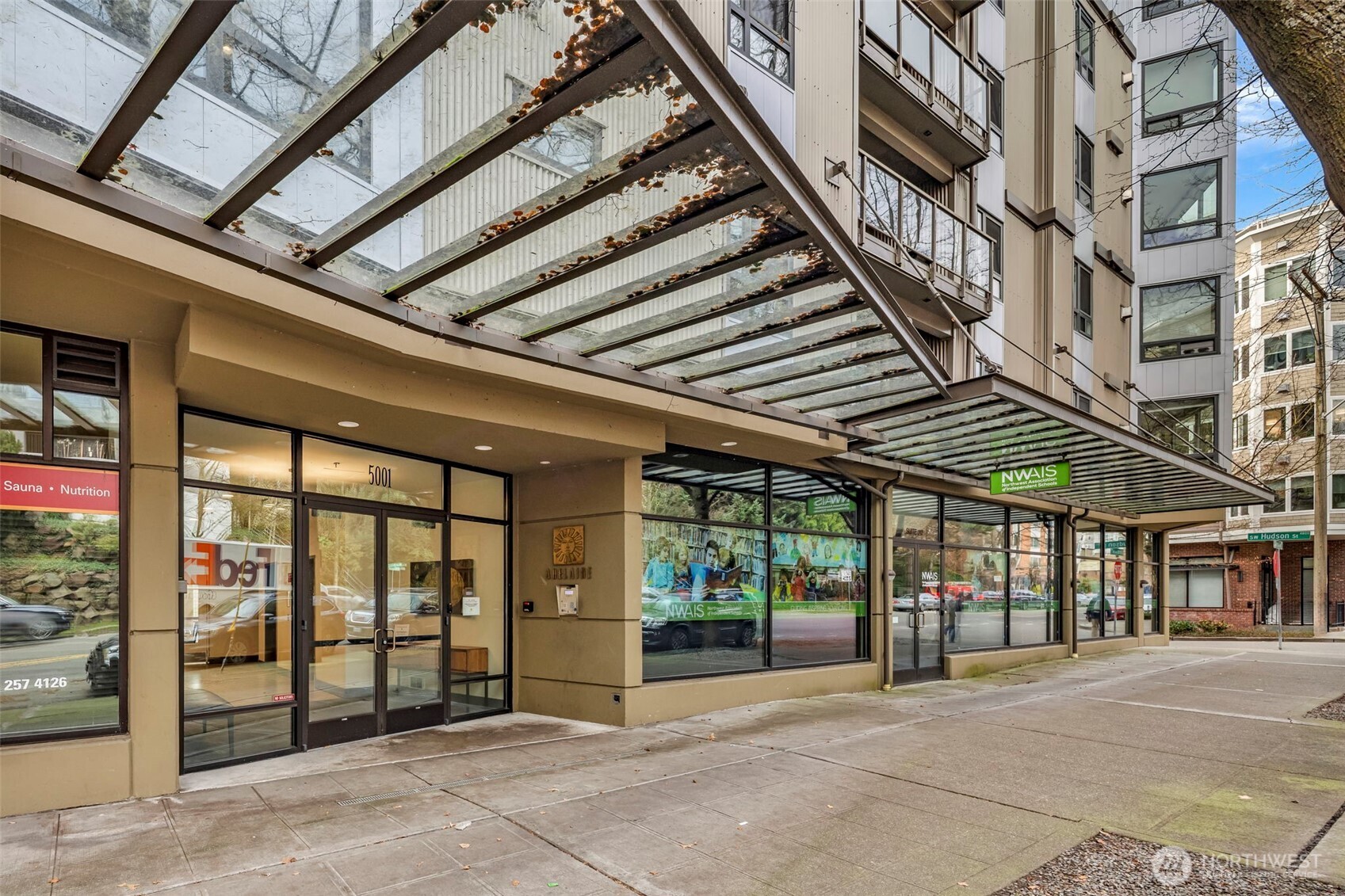5001 California Avenue Southwest, Unit 103 Seattle, WA 98136 - Photo 5 of 40 a view of a building with a glass door