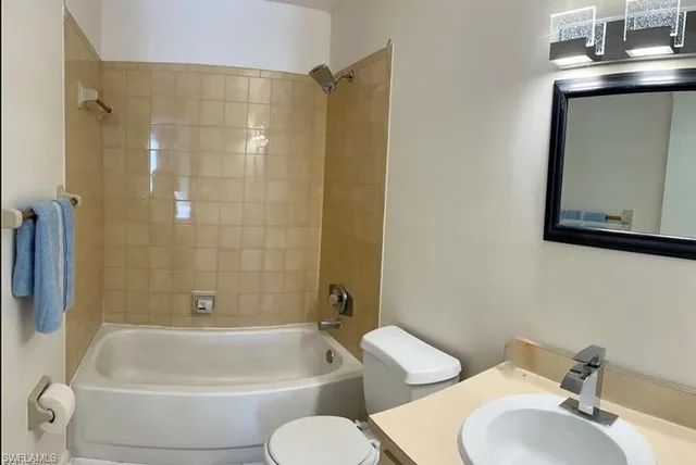 a bathroom with a toilet sink and bathtub