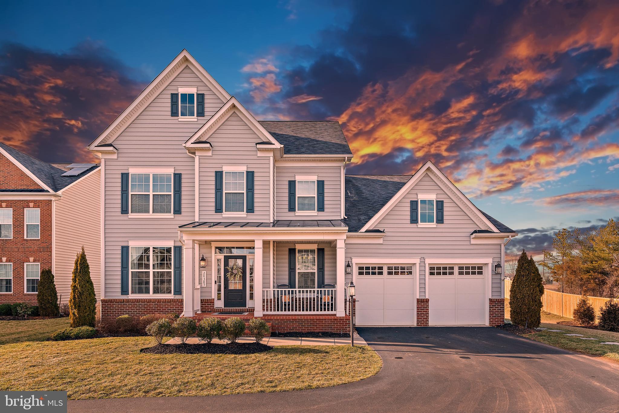 24385 Moon Glade Court Aldie, VA 20105 - Photo 1 of 51 a front view of a house with a yard