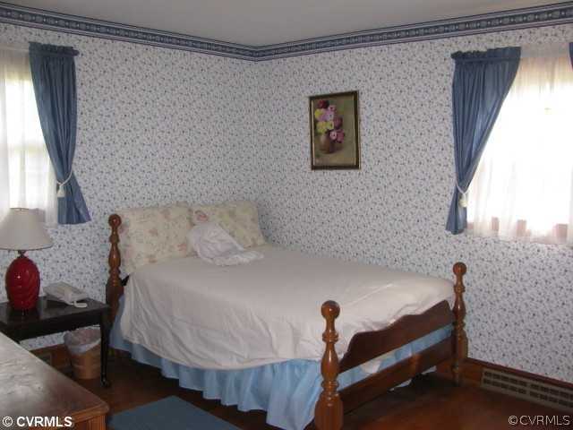 2034 Tuggle Road Farmville, VA 23901 - Photo 11 of 12 a bedroom with a bed and a table