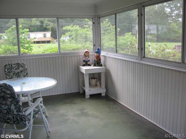 2034 Tuggle Road Farmville, VA 23901 - Photo 7 of 12 a view of a room that has a lot of furniture and a window