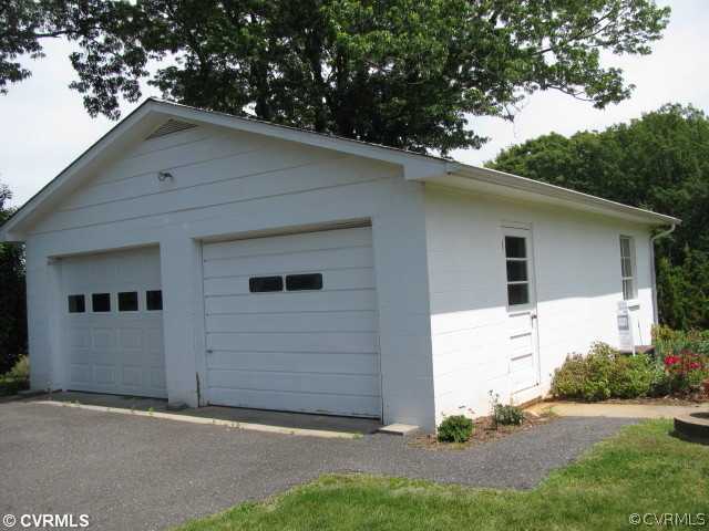 2034 Tuggle Road Farmville, VA 23901 - Photo 8 of 12 a white house that has tree in front of it