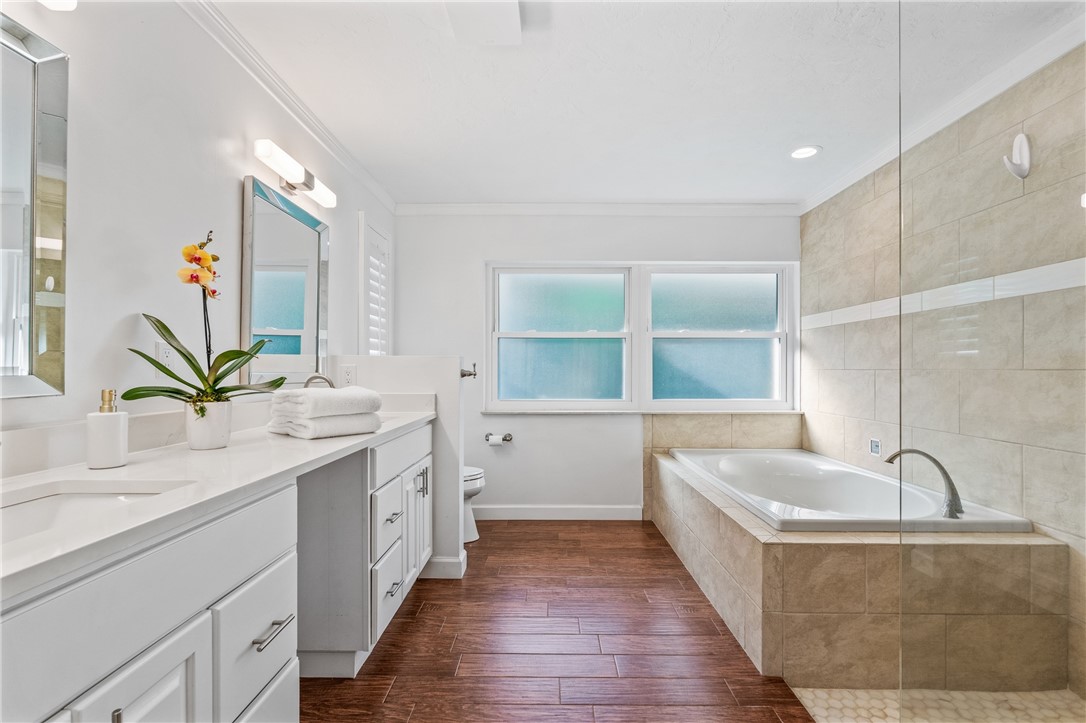 1939 Ocean Ridge Circle Vero Beach, FL 32963 - Photo 15 of 33 a bathroom with a tub sink and mirror