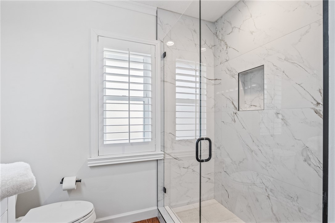 1939 Ocean Ridge Circle Vero Beach, FL 32963 - Photo 18 of 33 a bathroom with a granite countertop toilet sink and shower