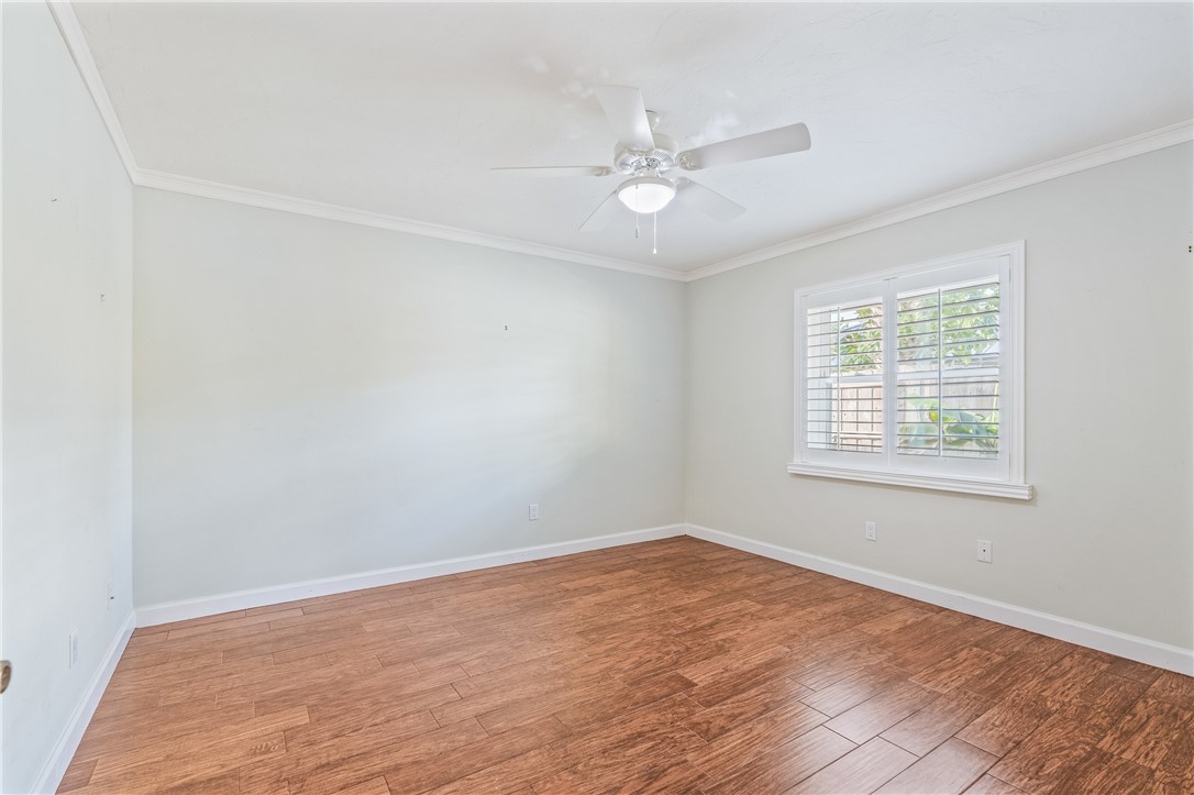 1939 Ocean Ridge Circle Vero Beach, FL 32963 - Photo 19 of 33 wooden floor in an empty room with a window