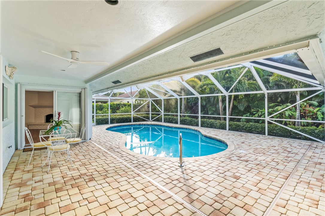 1939 Ocean Ridge Circle Vero Beach, FL 32963 - Photo 29 of 33 a view of a swimming pool with a lounge chair