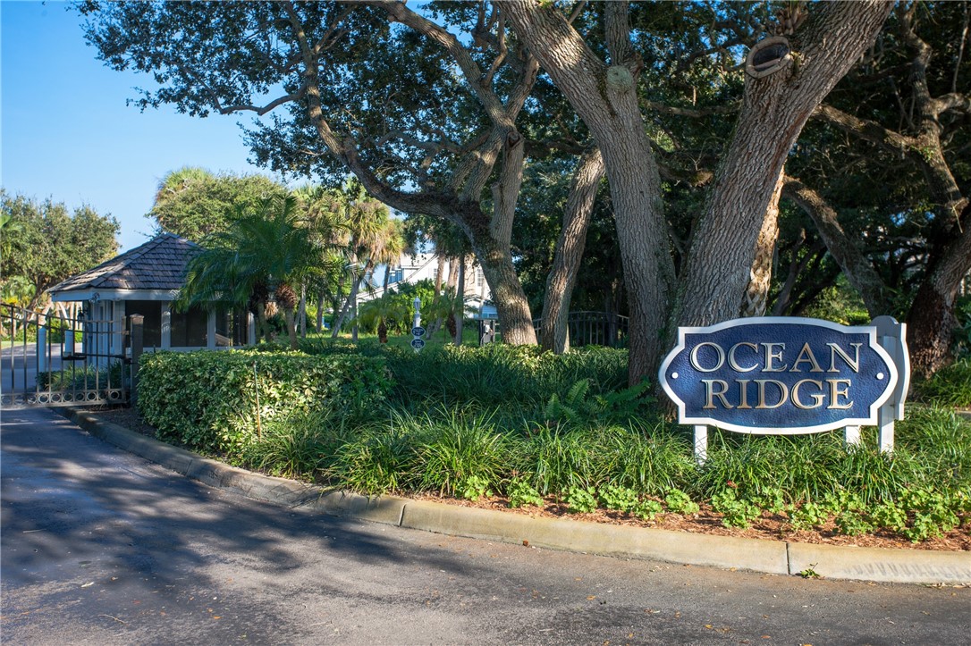 1939 Ocean Ridge Circle Vero Beach, FL 32963 - Photo 33 of 33 a sign that is on a tree in front of the house
