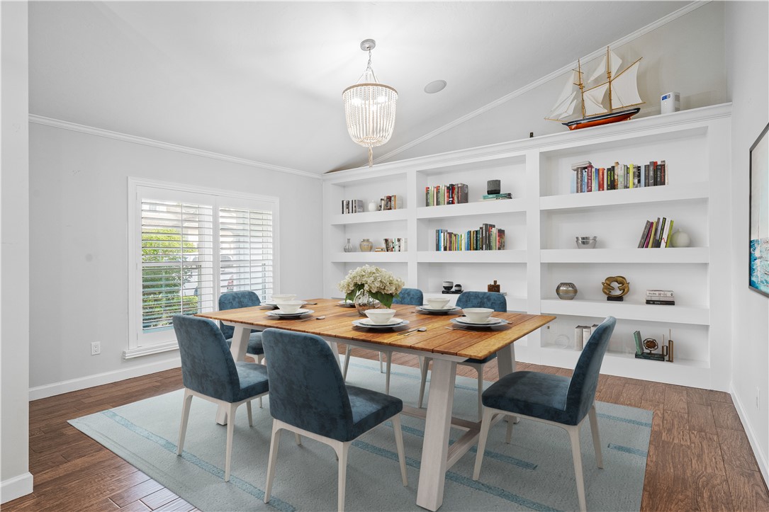 1939 Ocean Ridge Circle Vero Beach, FL 32963 - Photo 4 of 33 a dining room with a table chairs and a potted plant